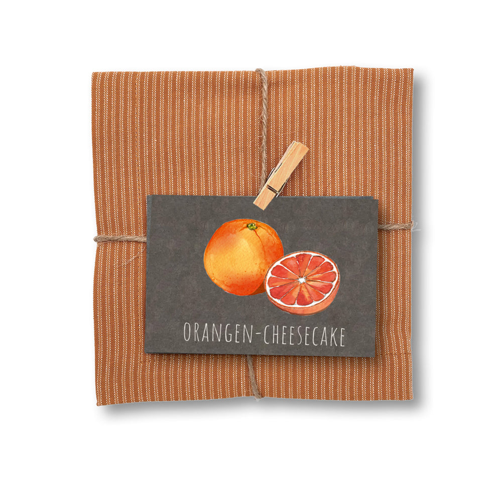 Geschirrtuch und Rezept "Orangen Cheesecake"